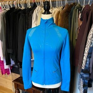 Bright blue zippered athletic sweater